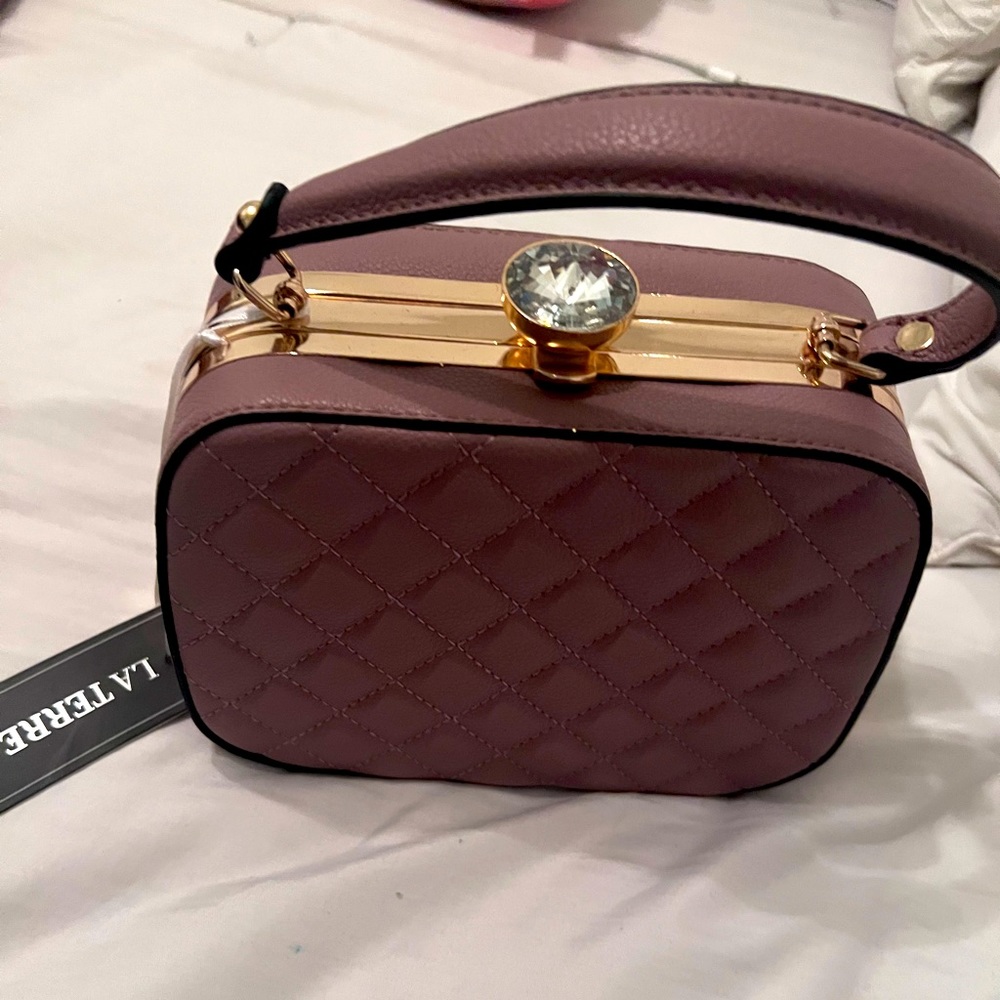 Women’s small clutch purse. Color brown. Brand new.